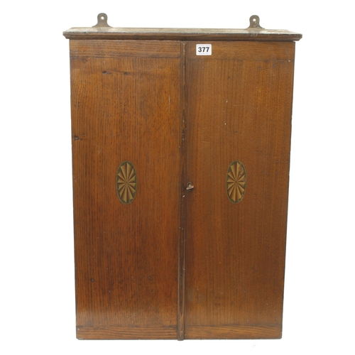 377 - A lockable oak hanging tools cabinet by Wm MARPLES 19