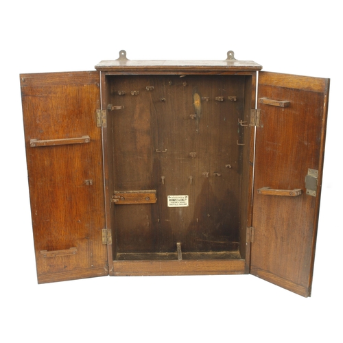 377 - A lockable oak hanging tools cabinet by Wm MARPLES 19