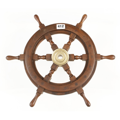 412 - A small craftsman made decorative ships wheel 10