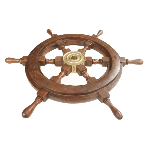 412 - A small craftsman made decorative ships wheel 10