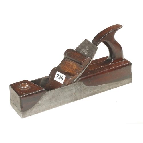 730 - A rare manufactured skew mouth iron panel plane with mahogany infill and elegant handle, the scrolle... 