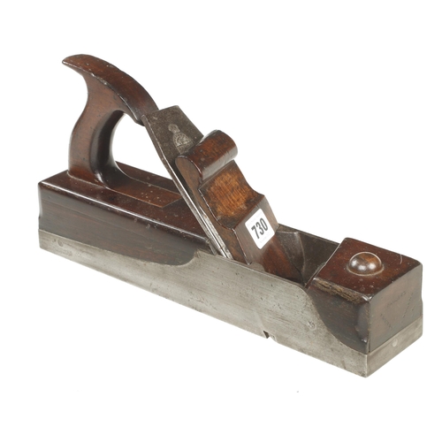 730 - A rare manufactured skew mouth iron panel plane with mahogany infill and elegant handle, the scrolle... 