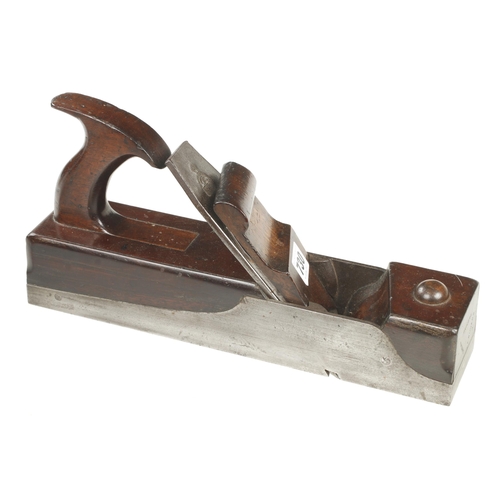 730 - A rare manufactured skew mouth iron panel plane with mahogany infill and elegant handle, the scrolle... 