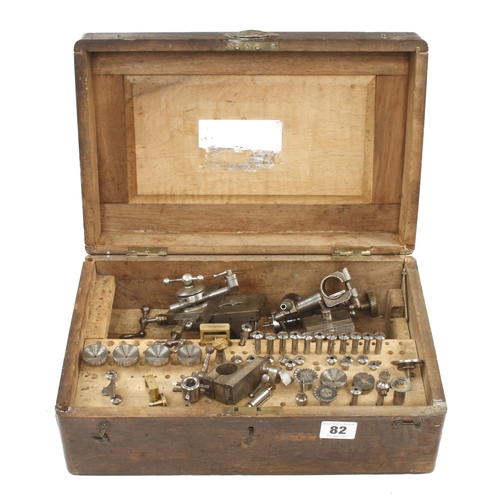 82 - A watchmaker's lathe with various collets and attachments in repaired box with plaque 