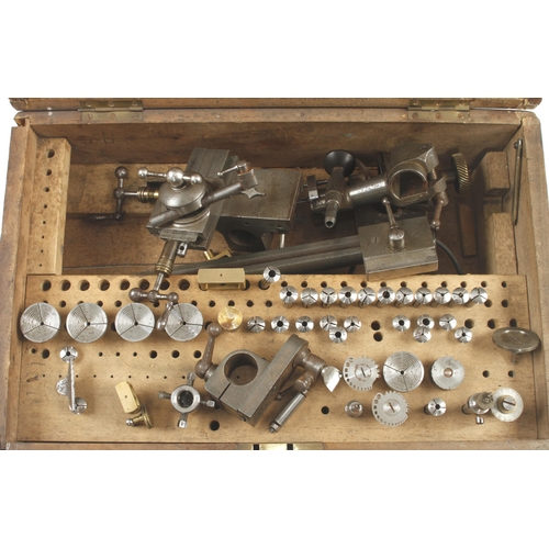 82 - A watchmaker's lathe with various collets and attachments in repaired box with plaque 