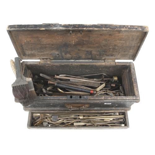 103 - A large collection of brass and steel sand moulder's tools in pine chest G+