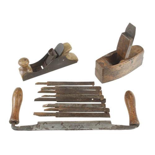 508 - A toothing plane, a German roughing plane, drawknife and 8 plough irons G