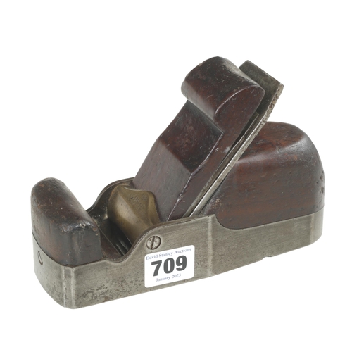 709 - An iron smoother by HOLLAND with rosewood infill and wedge G+