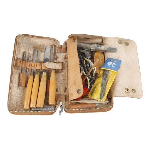 144 - A kit of 4 chisels and other tools in leather case G