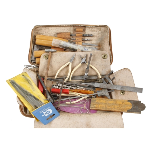 144 - A kit of 4 chisels and other tools in leather case G