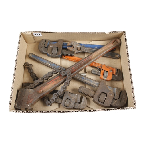 214 - A chain wrench, four stilson wrenches and an adjustable spanner G