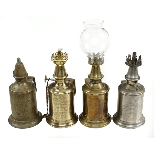 338 - A collection of 7 brass pigeon lamps, 4 with glass shades G+