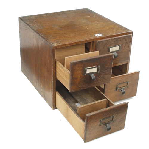 369 - A four drawer oak index card chest 16