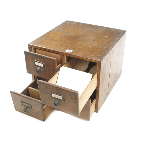 369 - A four drawer oak index card chest 16