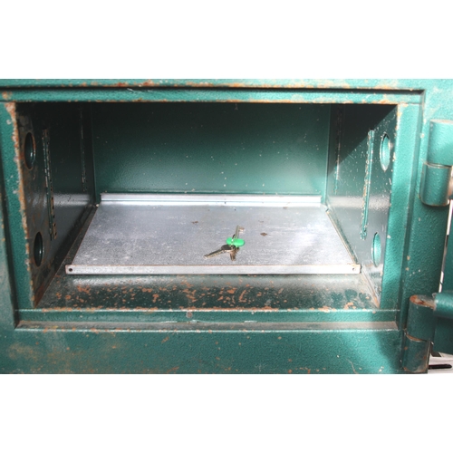 374 - A heavy steel safe 20