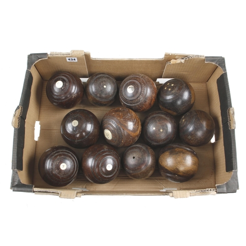 434 - 12 lignum bowls G+