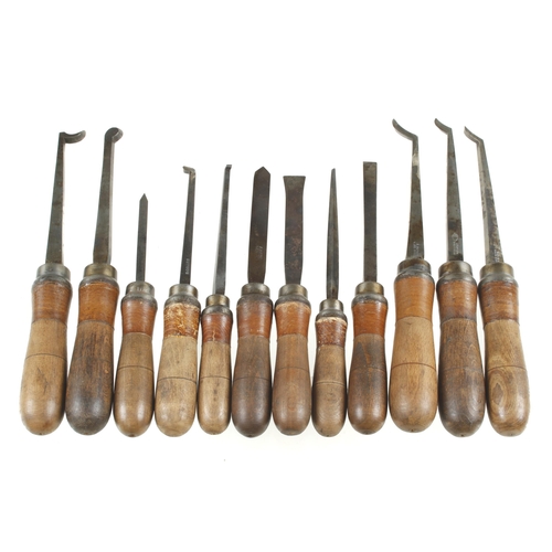 591 - A set of 12 ornamental turning tools with matching handles G+