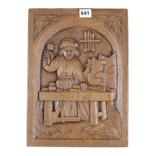 641 - A resin copy of a carved panel of a carpenter at his bench 10