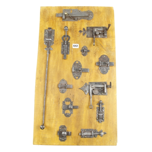 642 - A display board of 13 French iron cupboard locks or catches 28