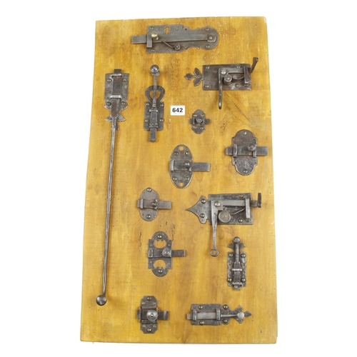 642 - A display board of 13 French iron cupboard locks or catches 28