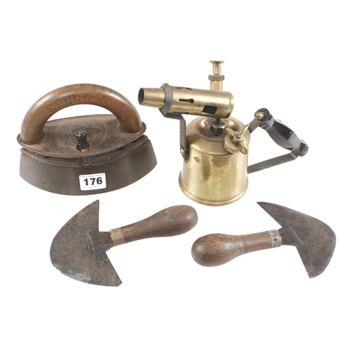 176 - A smoothing iron by KENRICK c/w slug, a brass blow torch and two leather knives G