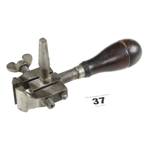 37 - A small hand vice with tools in rosewood handle G+