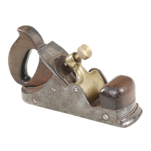 725 - A Scottish style iron smoother with stepped toe and brass lever G