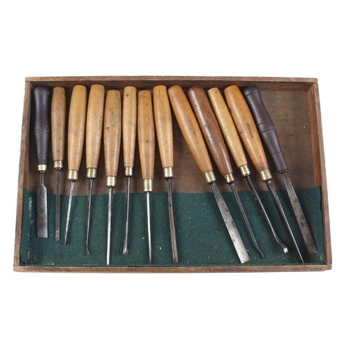 808 - A craftsman's kit of 55 carving tools and sharpening stones in 5 trays in box G+