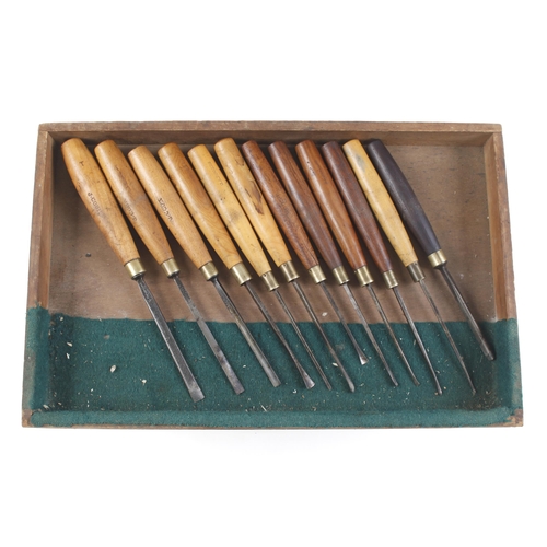 808 - A craftsman's kit of 55 carving tools and sharpening stones in 5 trays in box G+