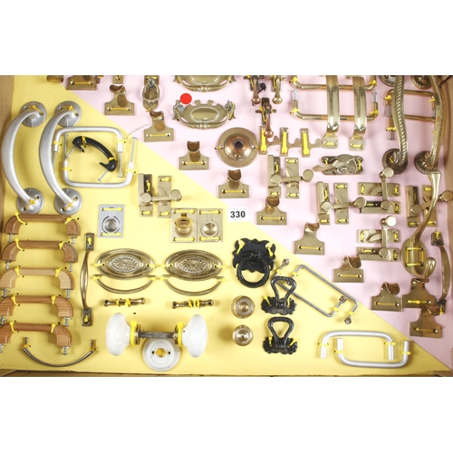 330 - A display of 64 mainly brass cabinet handles, hooks and fittings F