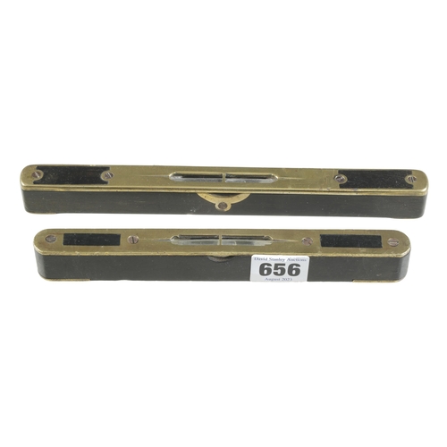 656 - Two ebony and brass levels 8