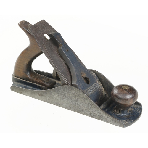 669 - An early STANLEY No 4 1/2 pre adjustable frog smoother, crack to handle and Record iron G