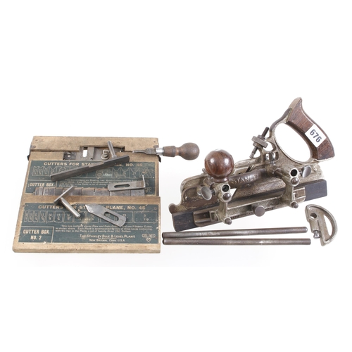 676 - A STANLEY No 45 plough with two boxes of cutters G+