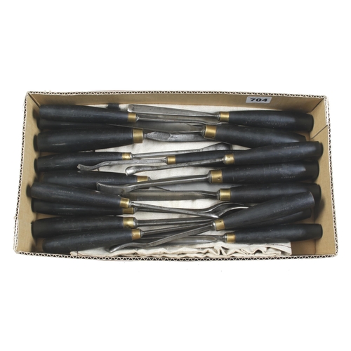 704 - A fine set of 18 carving tools by HENRY TAYLOR with ebony handles G++