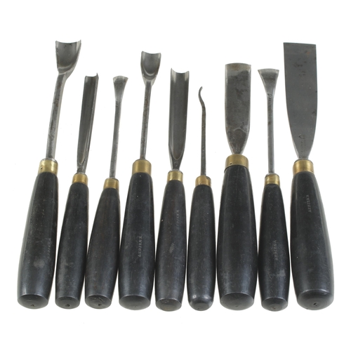 704 - A fine set of 18 carving tools by HENRY TAYLOR with ebony handles G++