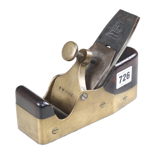 726 - A small steel soled brass smoother 7