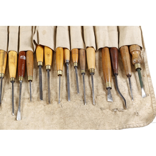 818 - A craftsmans roll of 26 carving tools incl. 6 V grooving tools of different sizes G+