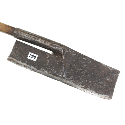 226 - An unusual R/H side axe with 14