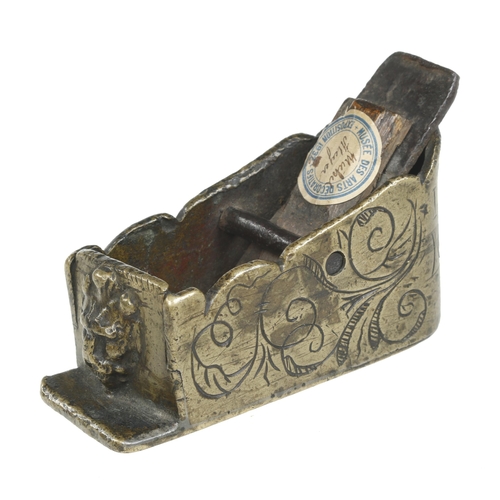 An important and very rare, dated, early 17c German bronze block plane 4" x 1 1/2" profusely decorated overall with "lions head" feature protruding from the toe and dated 1632 around the heel. Provenance; this plane was displayed in the Musee des Arts Decoratifs, Exposition 1932 and later in the Michel Rullier Collection in France, a similar undated plane was sold for £5000 in England in 1988. This plane sold for £10500 in our catalogue No 56 Lot 417 in 2010 to an American collector G