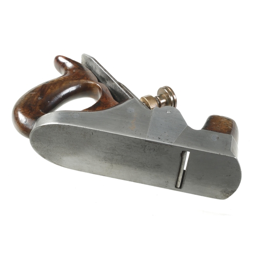 162 - A Scottish style iron smoother with over stuffed infill and handle with heart pierced brass lever, i... 