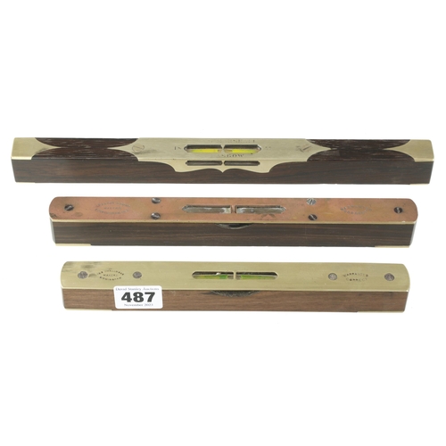 487 - Three brass topped figured rosewood levels 9