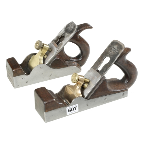 607 - Two parallel iron smoothers with brass levers 8