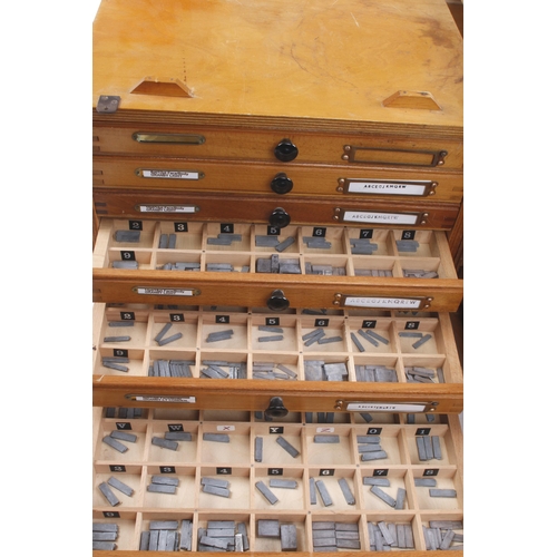 807 - Three chests of compartmented drawers containing numerous brass and metal stamps plus a box of anoth... 