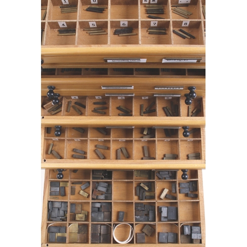 807 - Three chests of compartmented drawers containing numerous brass and metal stamps plus a box of anoth... 