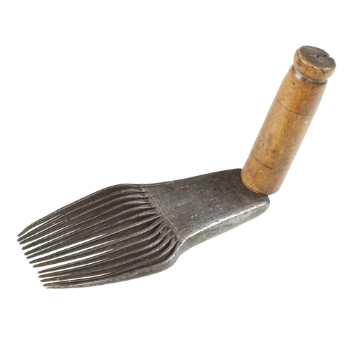 823 - An early, little used French flax dressing tool with decoration to stock, the comb 8