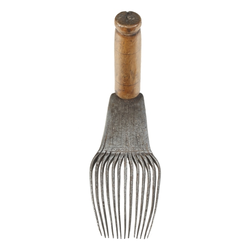 823 - An early, little used French flax dressing tool with decoration to stock, the comb 8