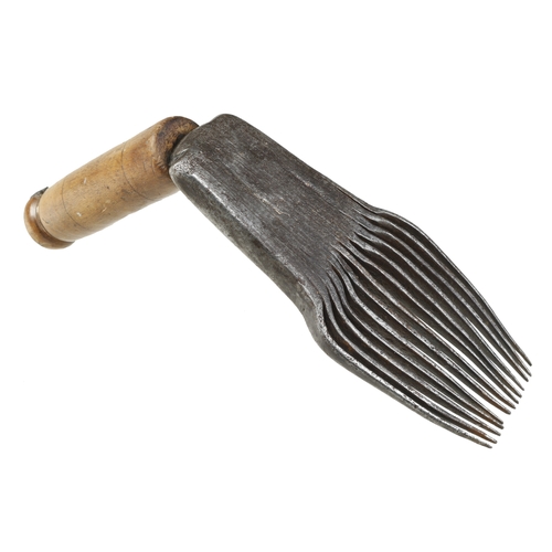 823 - An early, little used French flax dressing tool with decoration to stock, the comb 8