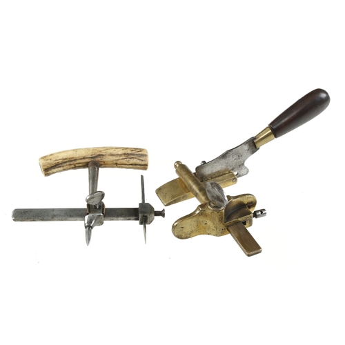 911 - A leatherworker's brass plough and a horn handled circle cutter both by BLANCHARD Paris G
