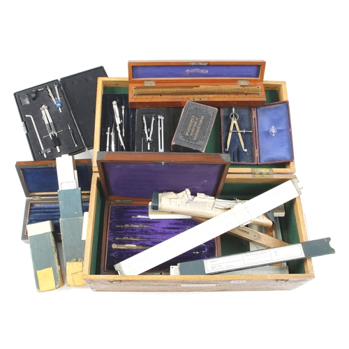 143 - Various slide rules and part drawing sets in oak box G-