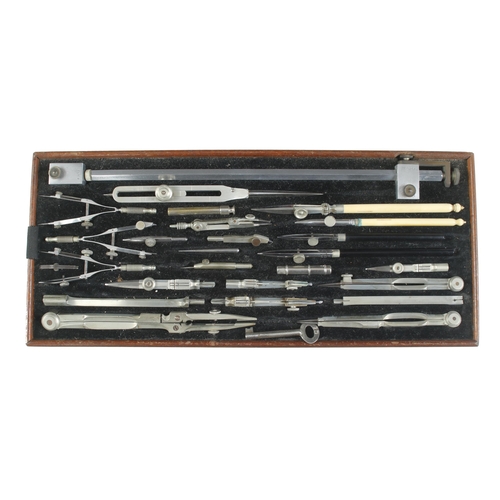 216 - A set of German silver drawing instruments and various rules in lockable mahogany box G